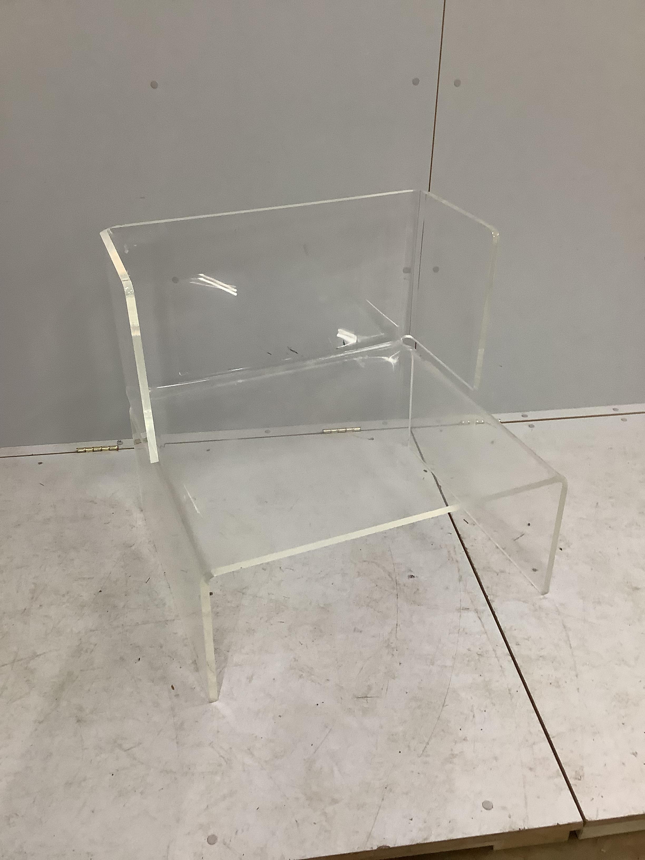 A contemporary mid century Lucite acrylic chair, width 73cm, depth 60cm, height 80cm